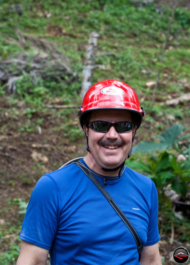 man wearing a silly red helmet Cascada El Limon Dominican Republic