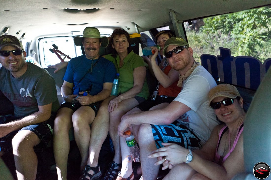 group of people taking a ride in a van