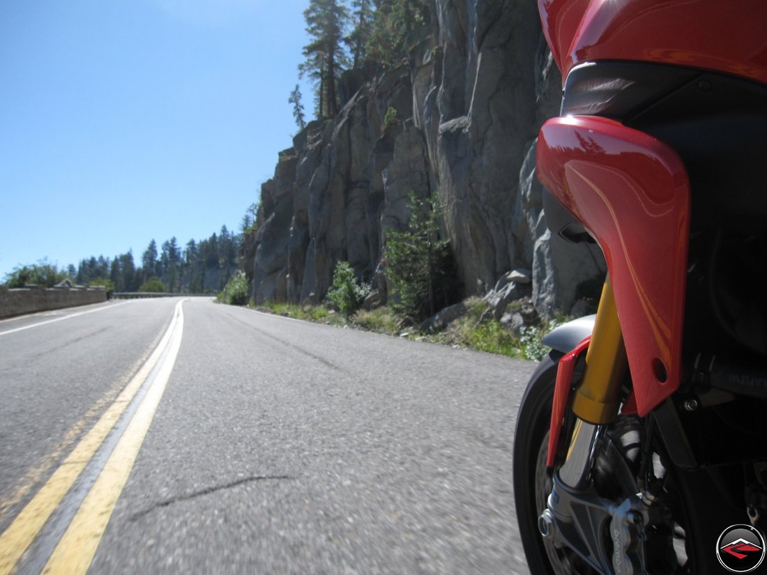 Riding a Ducati Multistrada 1200 along California Highway 89, Emerald Bay Road, along Lake Tahoe, with a cool rock wall on the edge of the road