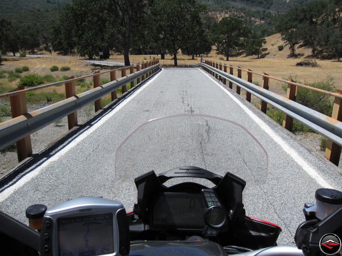 Ducati Multistrada stopped on a single lane bridge along California Highway 130, Del Puerto Canyon Road, while heading to the top of Hamilton Mountain