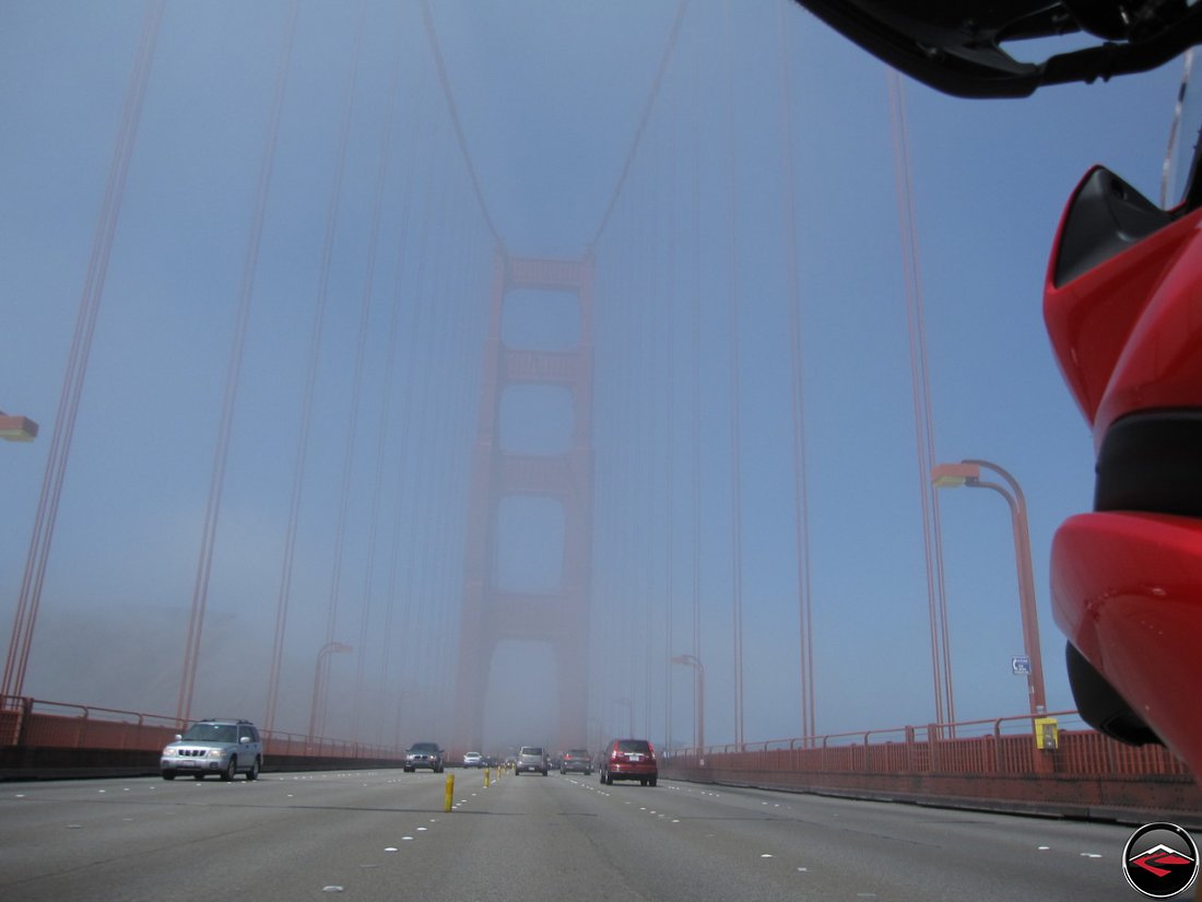 Riding a Ducati Multistrada 1200 motorcycle across the Golden Gate Bridge, in Californai, in the fog