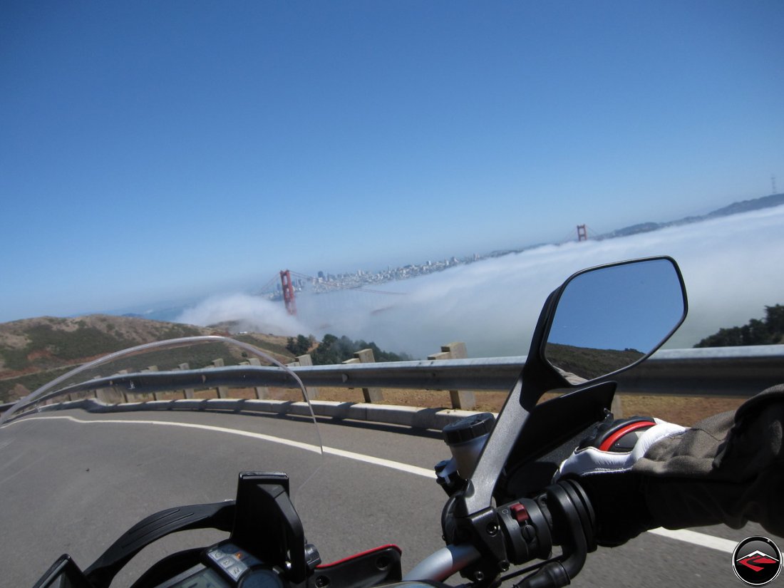 Riding a Ducati Multistrada 1200 motorcycle down California Conzelman Road, in the Golden Gate National Recreation Area, overlooking San Francisco and the Golden Gate Bridge