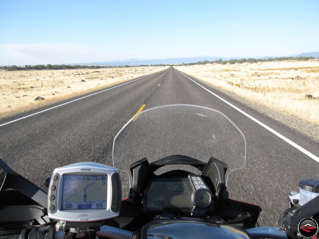 Ducati Multistrada 1200 dashboard, guages, speedometer, with a Garmin Zumo 450, staring down a long, lonesome California Highway 36, east of Quincy, Califorinia