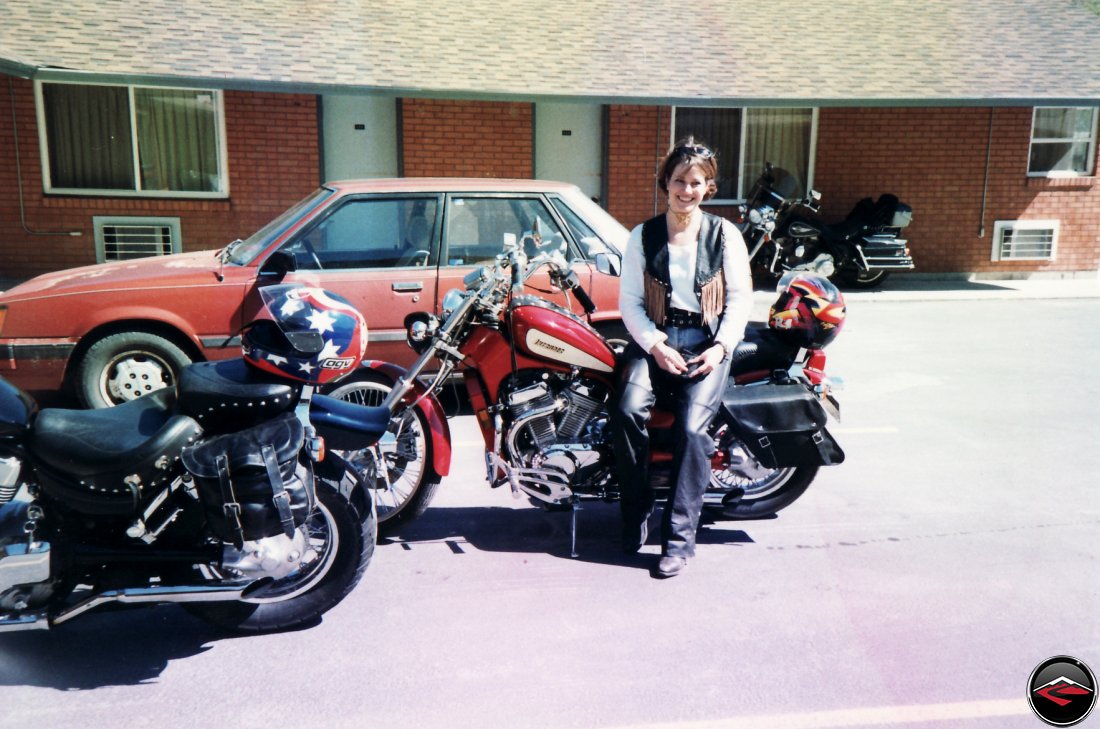 Pretty girl sitting on a Suzuki Intruder 800 in Sundance, Wyoming