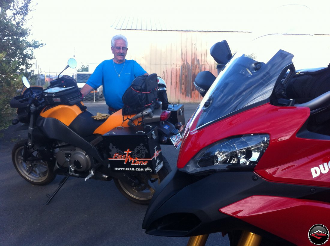 Unloading in Reno, Nevada. Ducati Multistrada 1200 headlights and Tom standing next to his Buell Ulysses with Happy Trails saddlebags side luggage