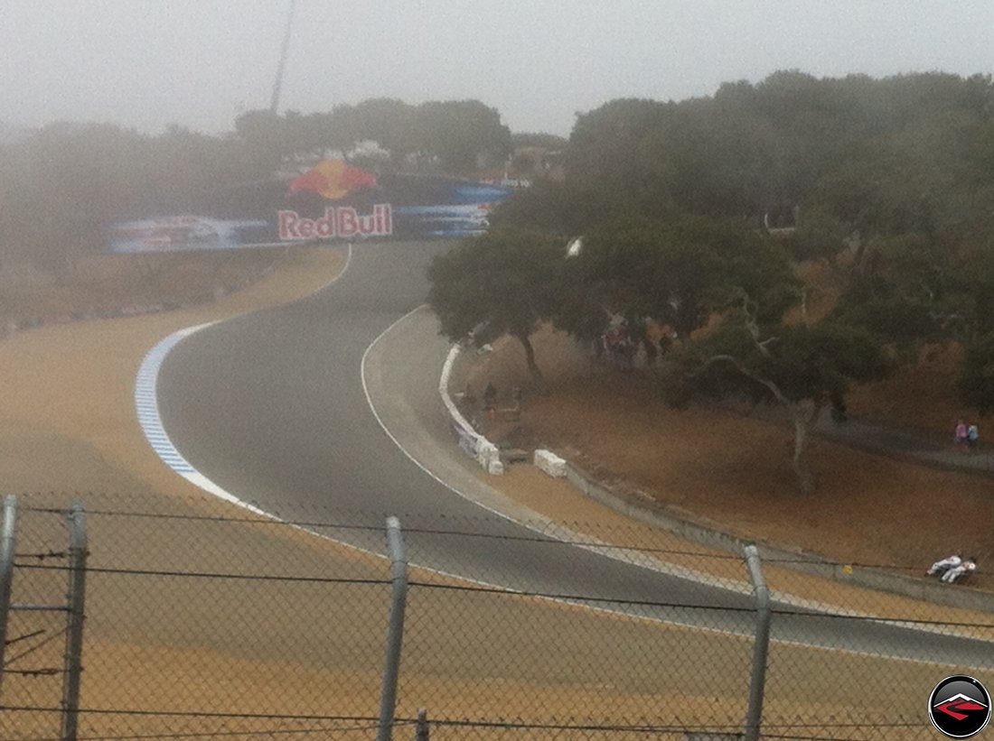 Early morning fog at Mazda Laguna Seca Raceway corkscrew, turns 7, 8 and 9, during Free Practice One, during the 2012 MotoGP Grand Prix