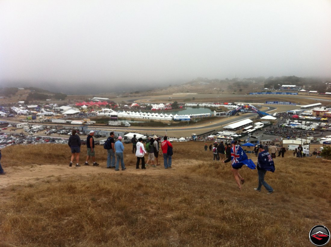 The view from the top of Mazda Laguna Seca Raceway, overlooking turn one and turn two, Ducati Island and all the vendors, in the fog, during the 2012 MotoGP Grand Prix Race weekend