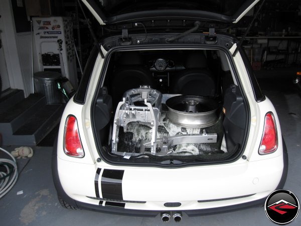 A Motorcycle in the back of a Mini Cooper